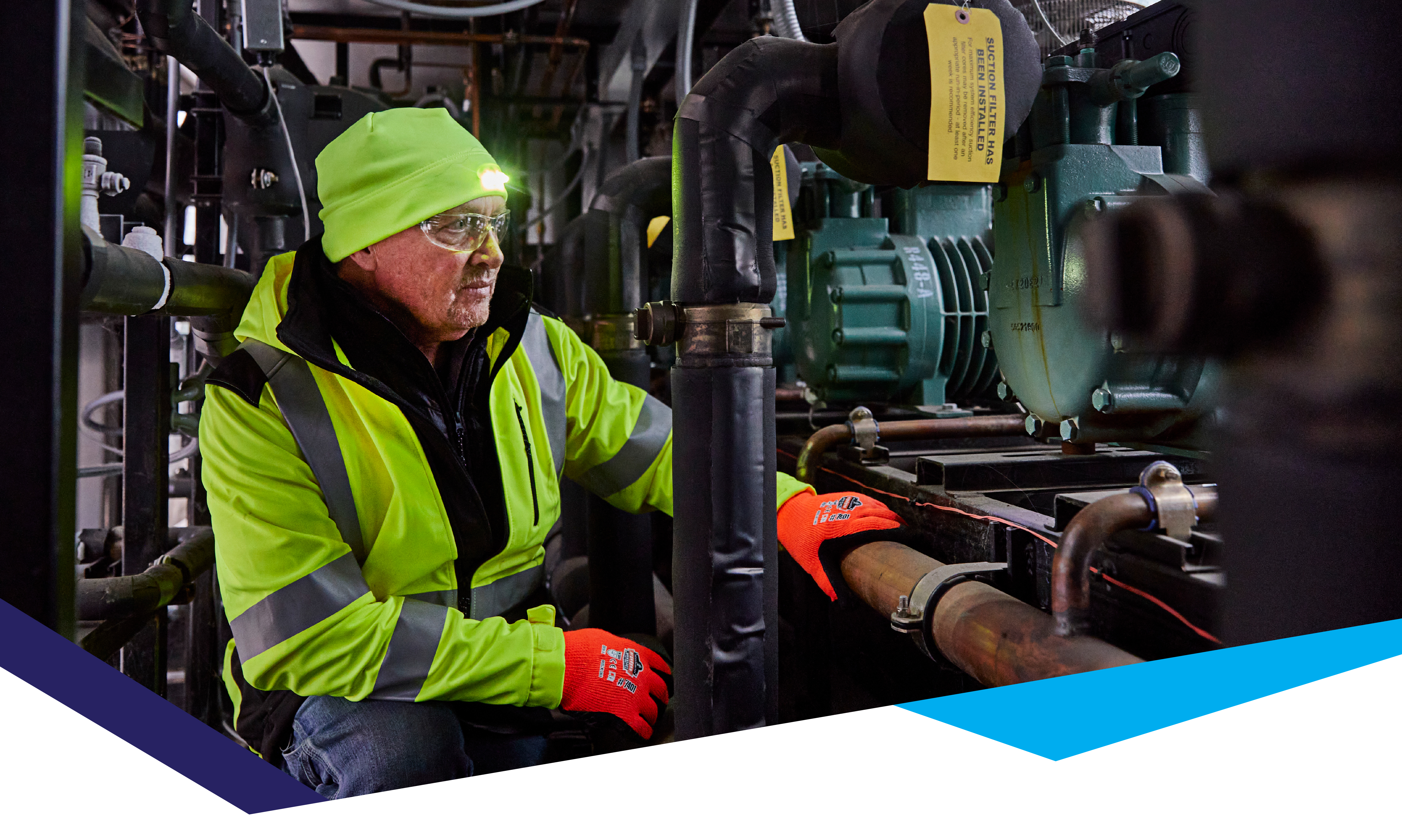 Worker wearing led winter hat while operating machinery