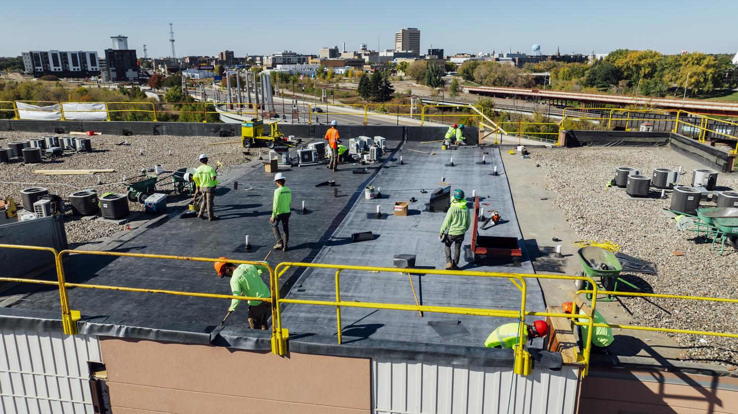 Herzog crew working on the roof of an apartment complex