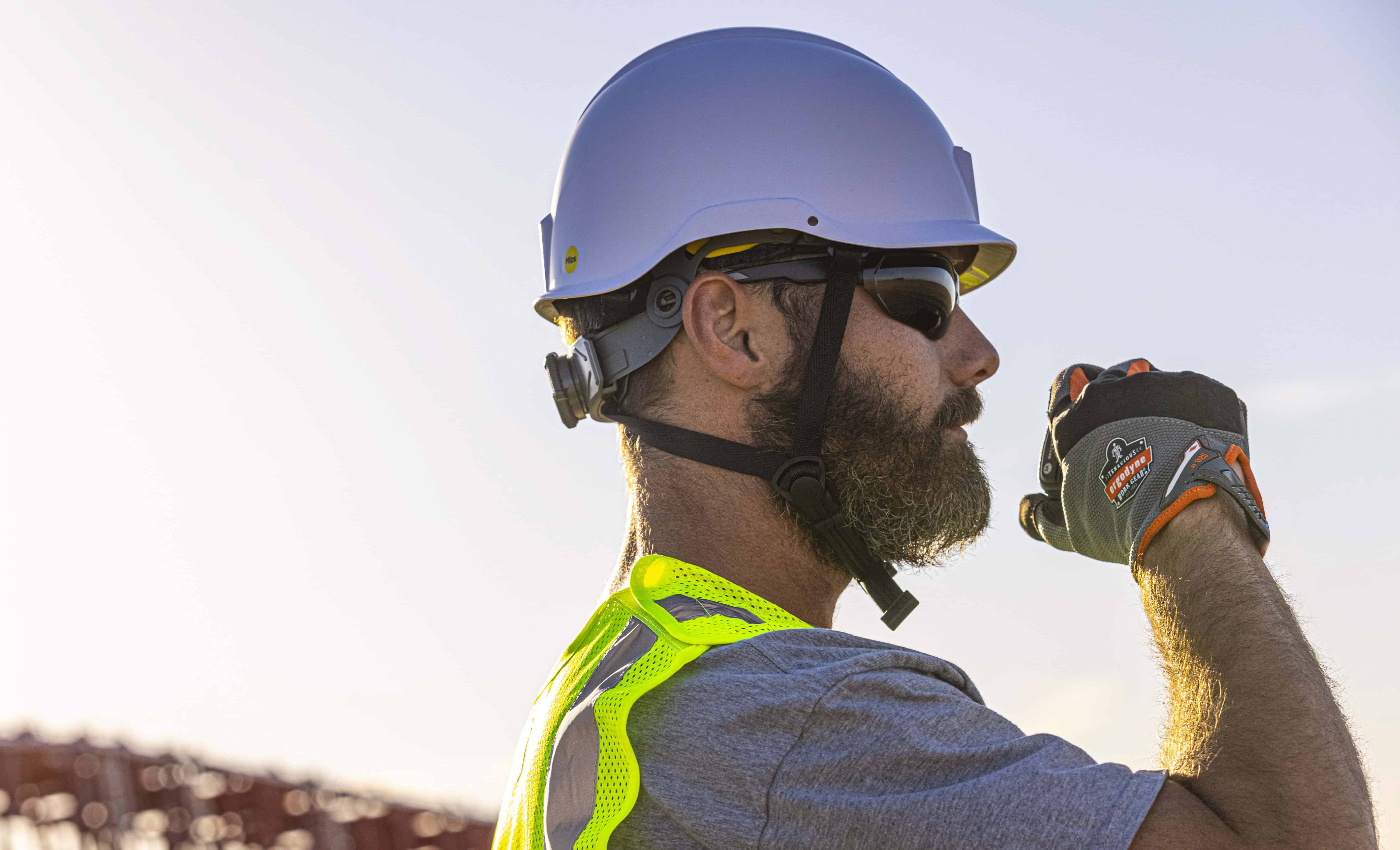 Worker wearing MIPS safety helmet