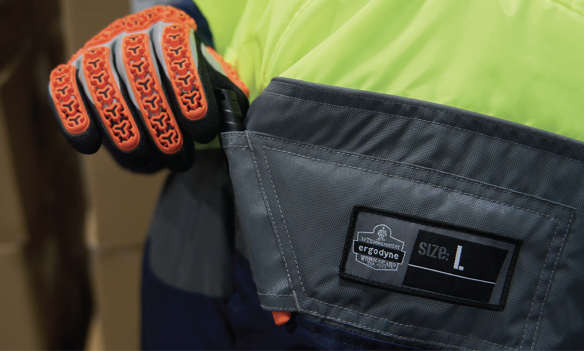 Image of cold storage worker grabbing a pen stored in the jacket