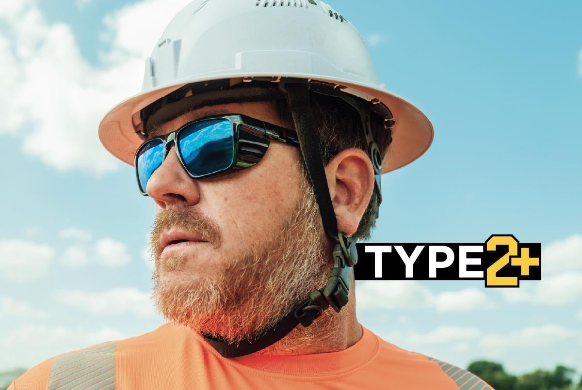 Worker wearing a type 2+ safety helmet
