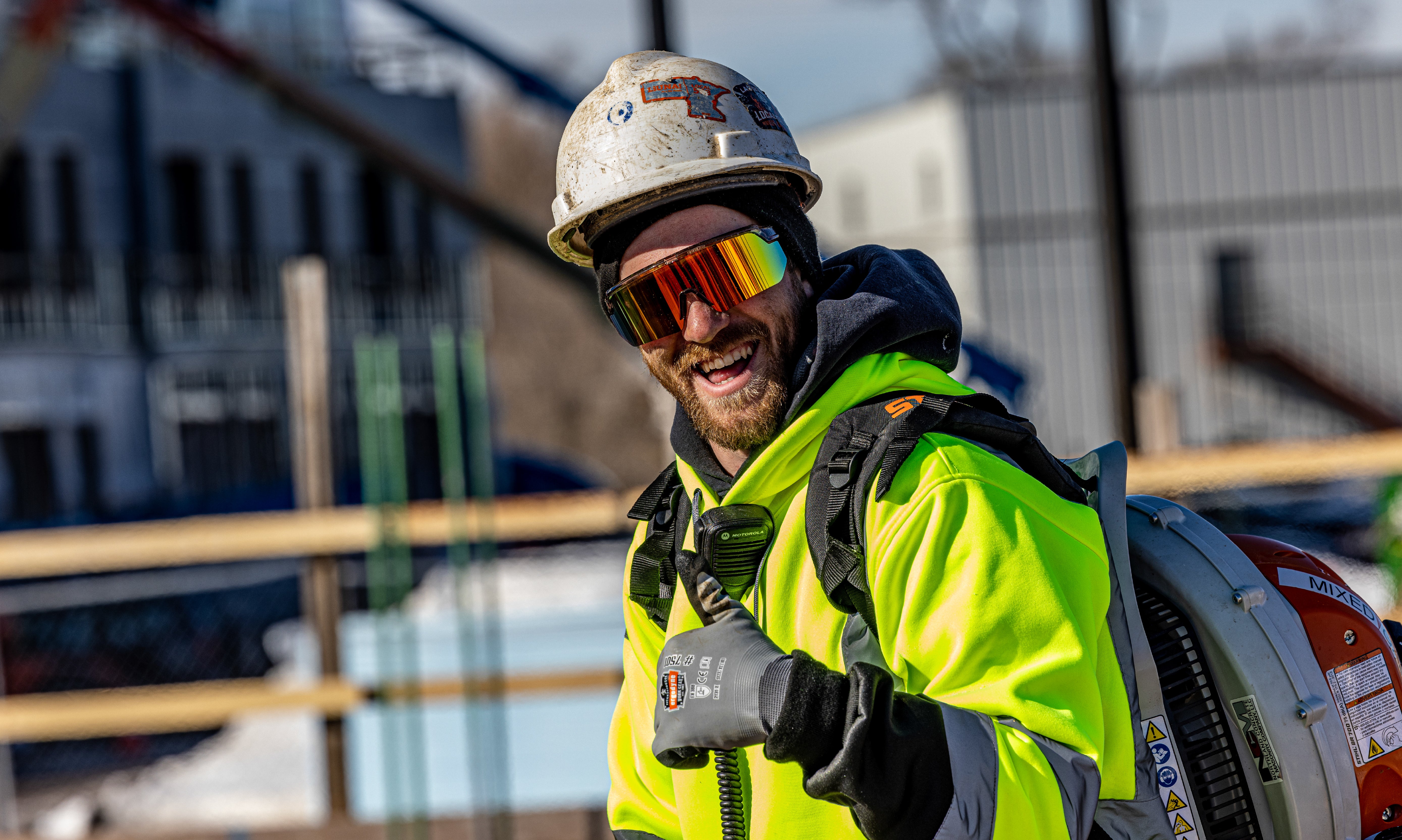 Worker wearing AEGIR polarized safety glasses and giving a thumbs up