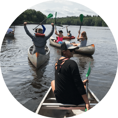 Ergodyne employees kayaking down a river
