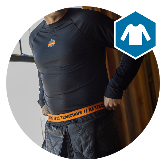 Person putting on base layer pants