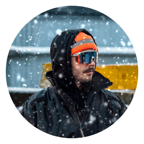 Person outside with snow falling, wearing Aegir Enhanced Anti-Fog Glasses