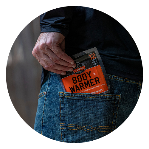 Person putting warming accessory into back pocket