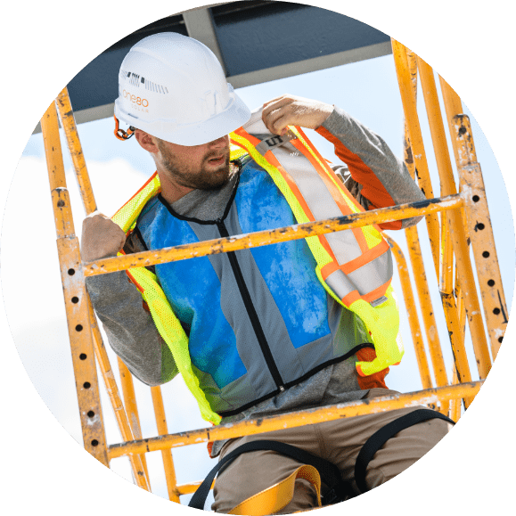 Worker in cooling vest