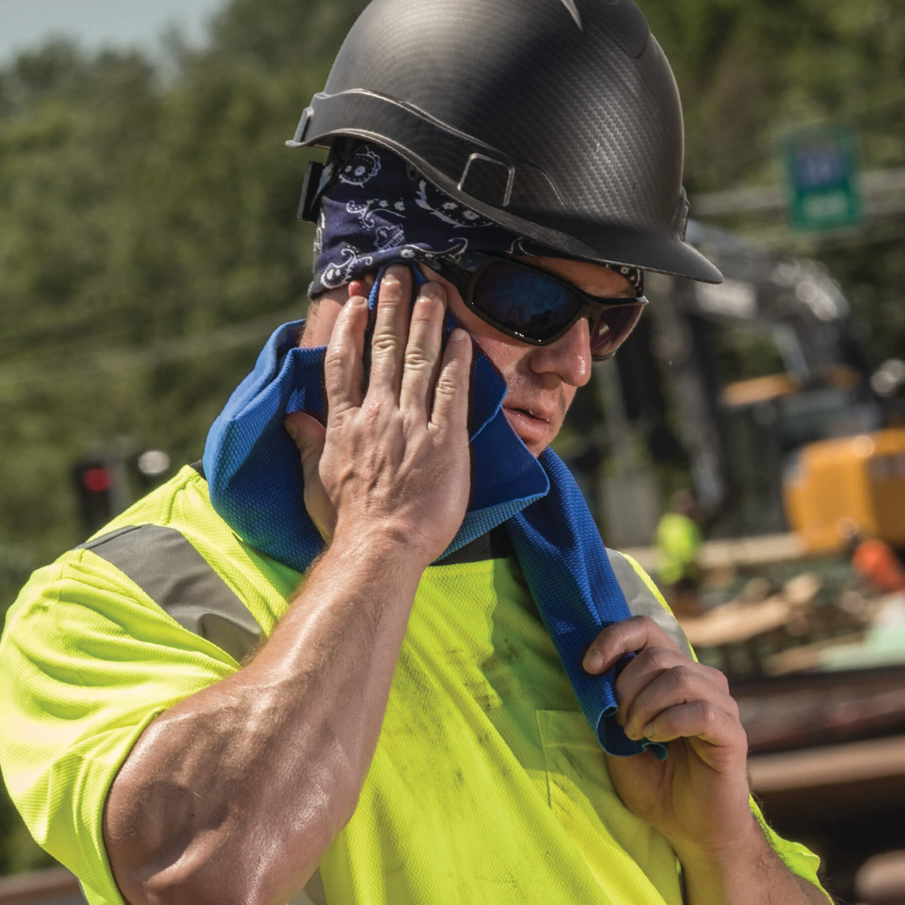 Worker using PVA cooling towel