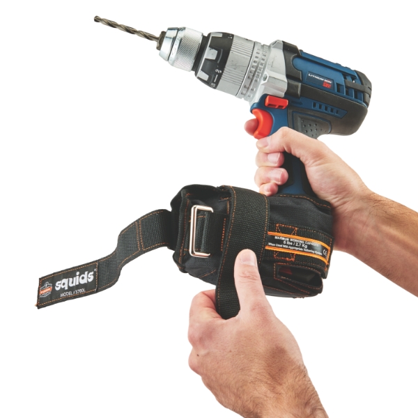 Person attaching tool trap to power drill