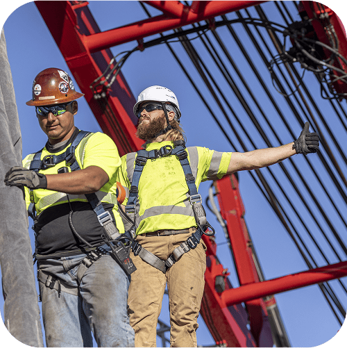 Workers in PPE on a jobsite