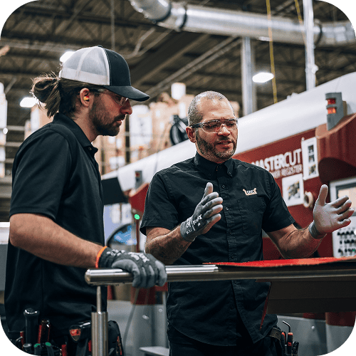 Herzog workers sitting at tables discussing safety