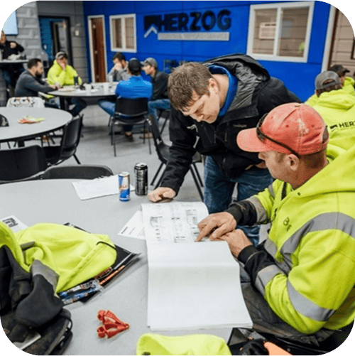 Workers in PPE on a jobsite
