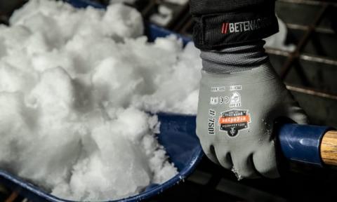 Full shovel handled by Ergodyne branded gloves