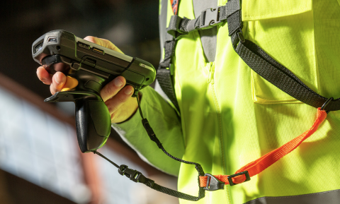 Supply Chain PPE worker using barcode scanner with scanner harness