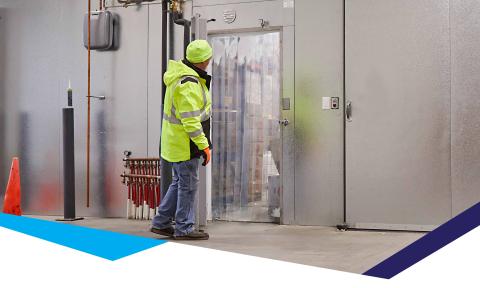 Worker entering a cold storage facility