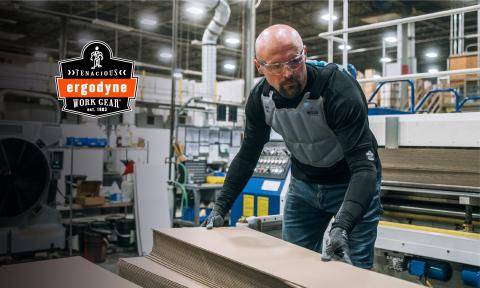 Worker wearing a cooling vest while working indoors