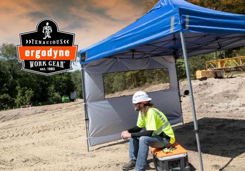 Worker sitting under a worksite pop-up tent