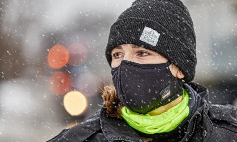 Worker wearing a face covering in the cold