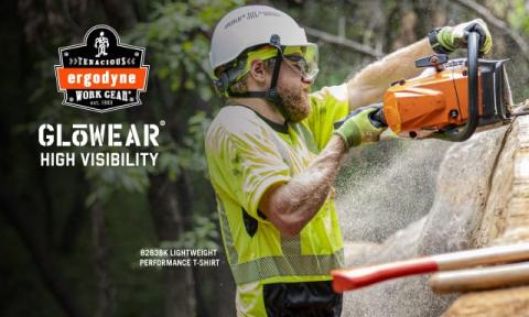 Man wearing hi-vis t-shirt chainsawing in the heat