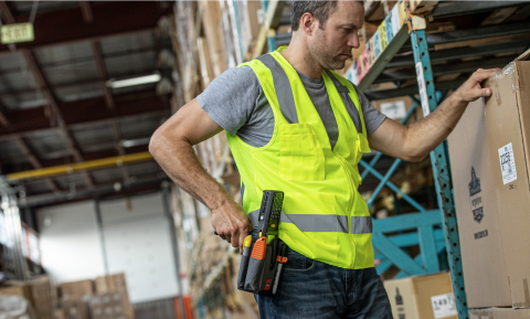 Worker holding scanner