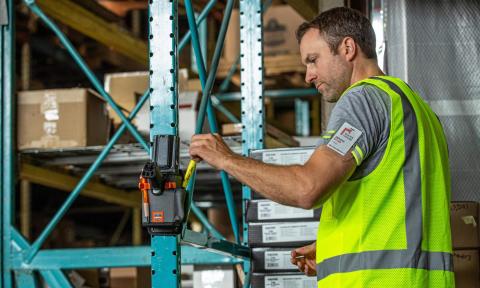 Worker in a warehouse wearing a hi-vis vest