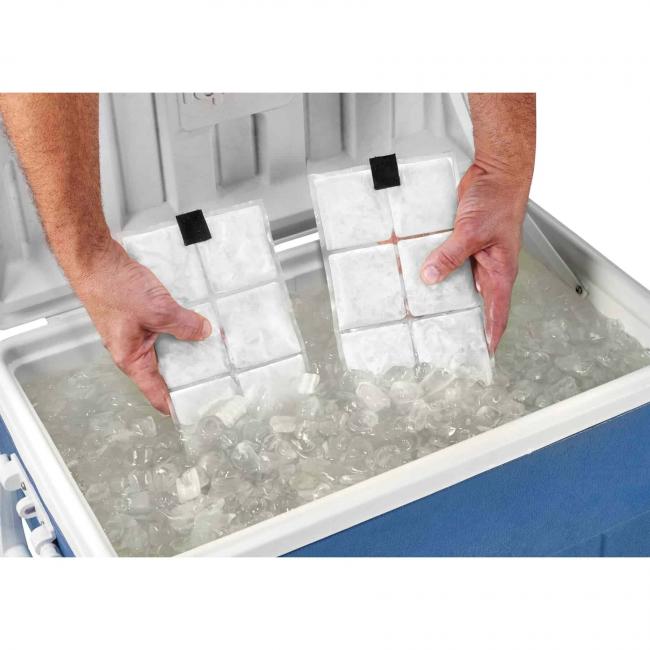 Person inserting cooling vest packs into cooler full of ice water