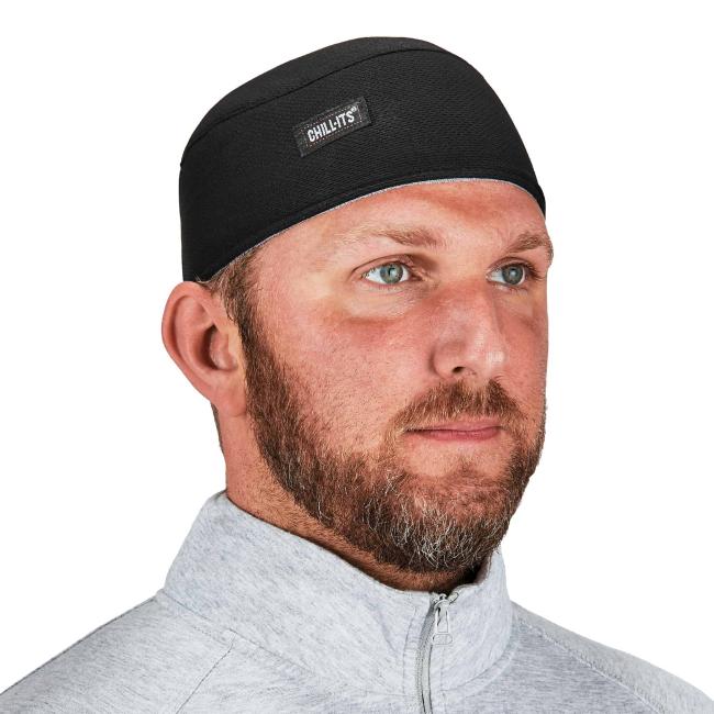 man wearing black skull cap image 1