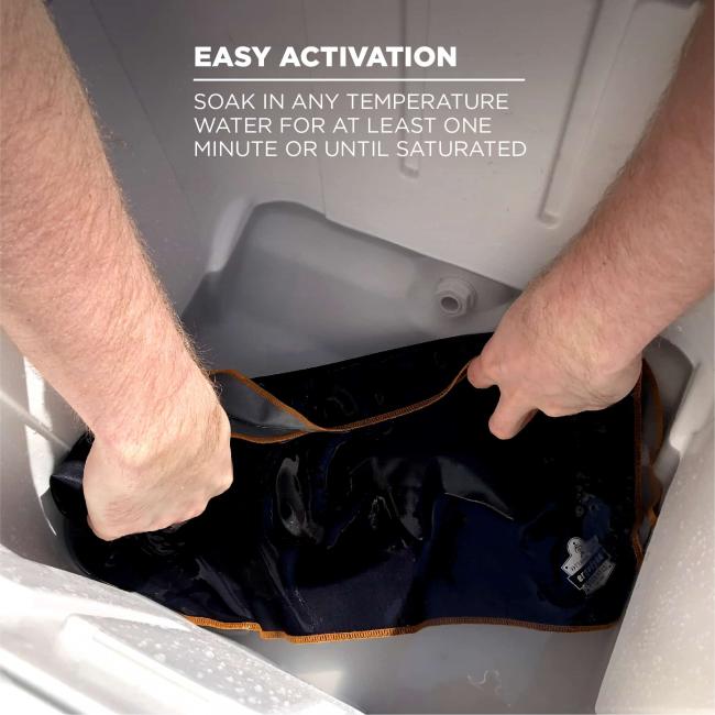 Easy activation: soak in any temperature water for at least one minute or until fully saturated. Image shows person putting towel into cooler full of water