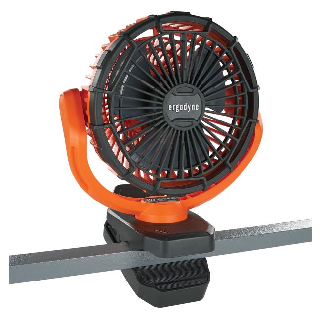 Fan clipped securely to a metal bar
