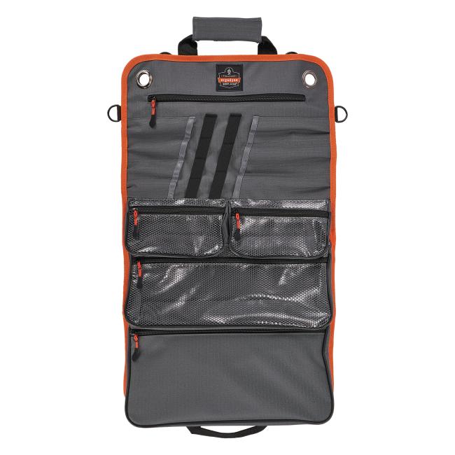 Open view of empty roll up tool bag with zippered pockets