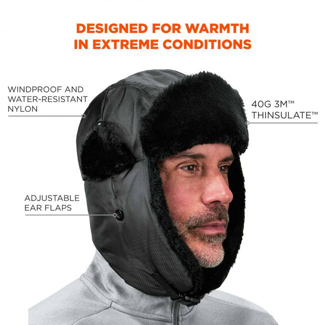 Designed for warmth in extreme conditions. Callout points to hat and says “windproof and water-resistant nylon”. Callout pointing to right side of hat says “40g 3M thinsulate”. Call out near bottom says “adjustable ear flaps”