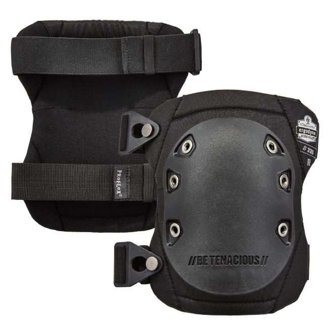 A pair of black knee pads featuring a hard rubber cap, wide elastic straps, adjustable buckles, and branding that reads “BE TENACIOUS” and “ProFlex by Ergodyne.”
