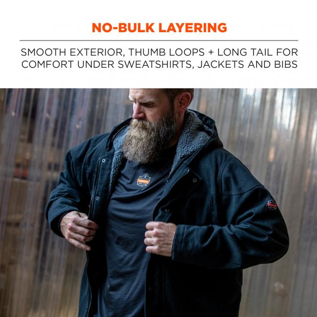 No-bulk layering: smooth exterior, thumb loops + long tail for comfort under sweatshirts, jackets and bibs