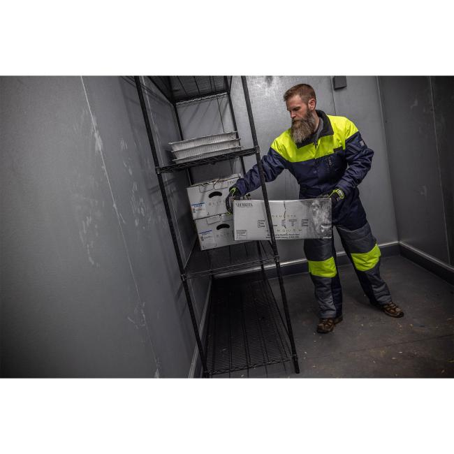 Model wearing 6475 insulated freezer coveralls