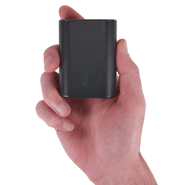 Portable battery power bank in hand