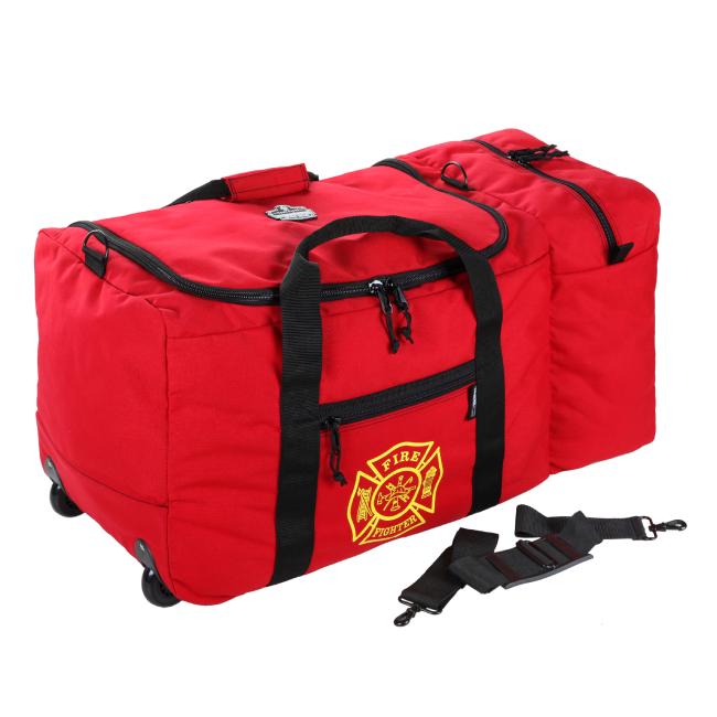 Red rolling duffel bag with black handles and zippers, yellow fire emblem on front, wheels and detached black shoulder strap.