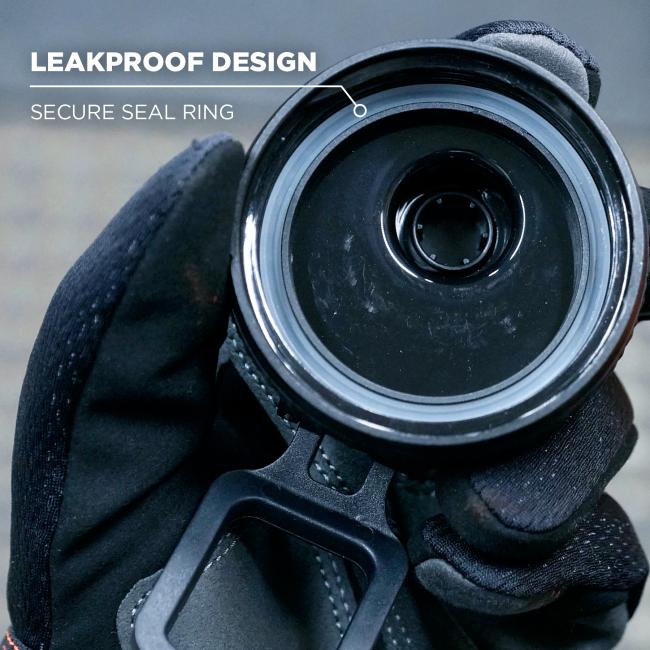 Close-up of circular black opening with white seal ring held in a gloved hand; white text "LEAKPROOF DESIGN" and "SECURE SEAL RING" at top left.