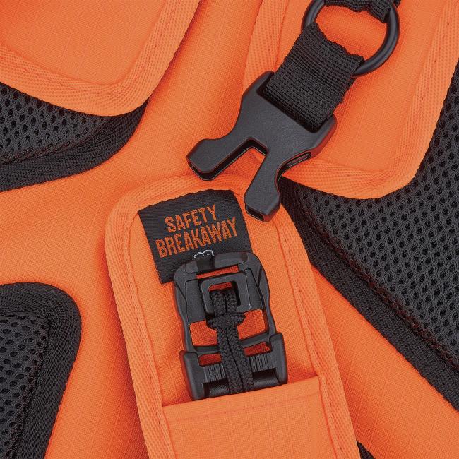 Close-up of orange textured fabric and black mesh with black plastic buckle and strap, and a tag reading 'SAFETY BREAKAWAY'.