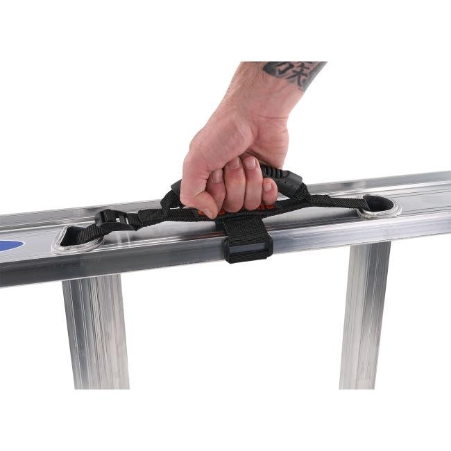 Hand holding extension ladder carrying handle on ladder