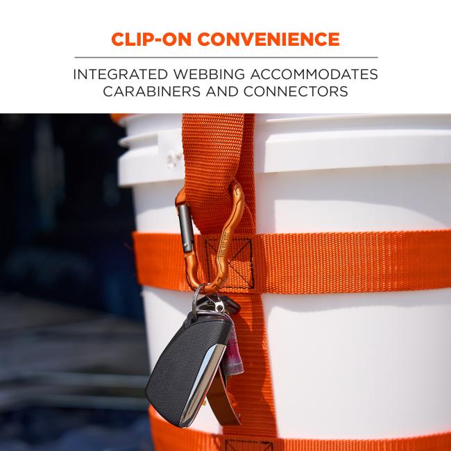Close-up of white bucket with bright orange webbing strap and orange carabiner clipped to a set of keys.