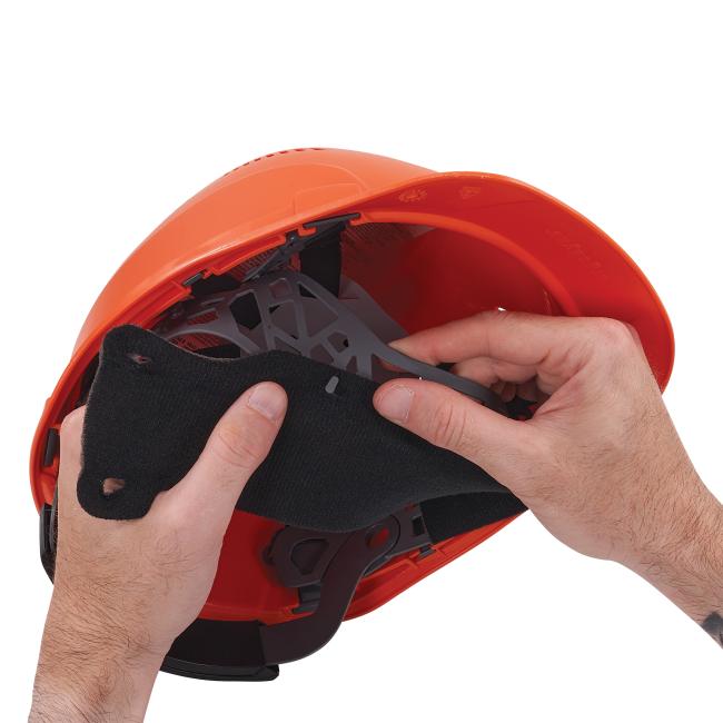 Detail picture of sweatband being inserted into safety helmet