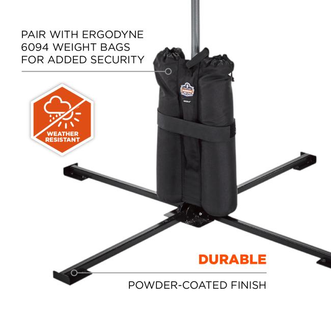 Black double weight bags wrapped around a vertical pole on a black X-shaped metal base, orange weather-resistant badge visible at left.