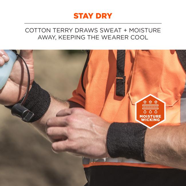 Close-up of person in bright orange textured shirt wearing black wristbands, holding a pale blue water bottle; "STAY DRY" text and moisture-wicking badge visible