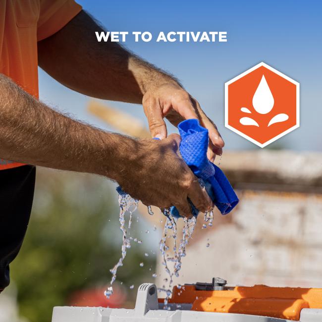 Close-up of wet hands wringing a blue cloth, water dripping, orange shirt sleeve, and orange water-drop icon with text 'WET TO ACTIVATE'.