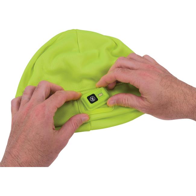 Lime winter skull cap with led light being installed