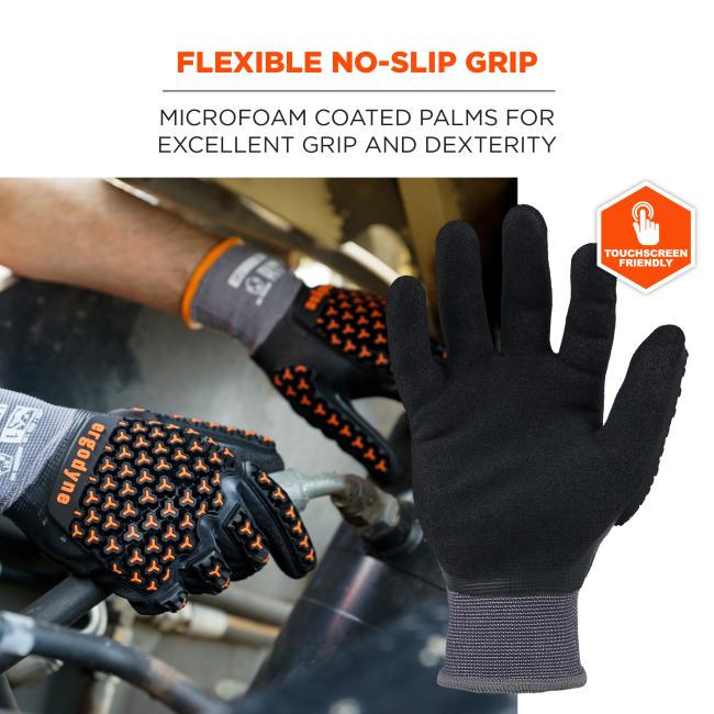 Black microfoam-coated work glove palm and fingers in foreground; background shows glove with orange textured grip and touchscreen badge