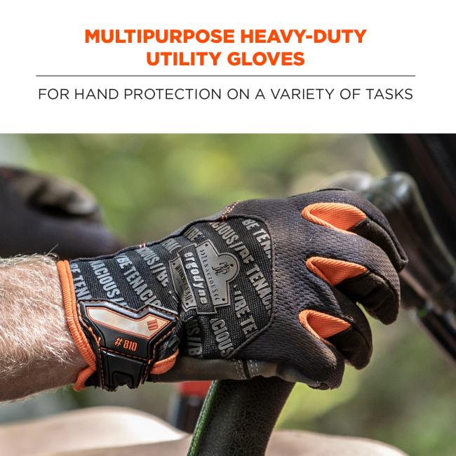 Close-up of two hands wearing black work gloves with orange accents gripping a black textured handle