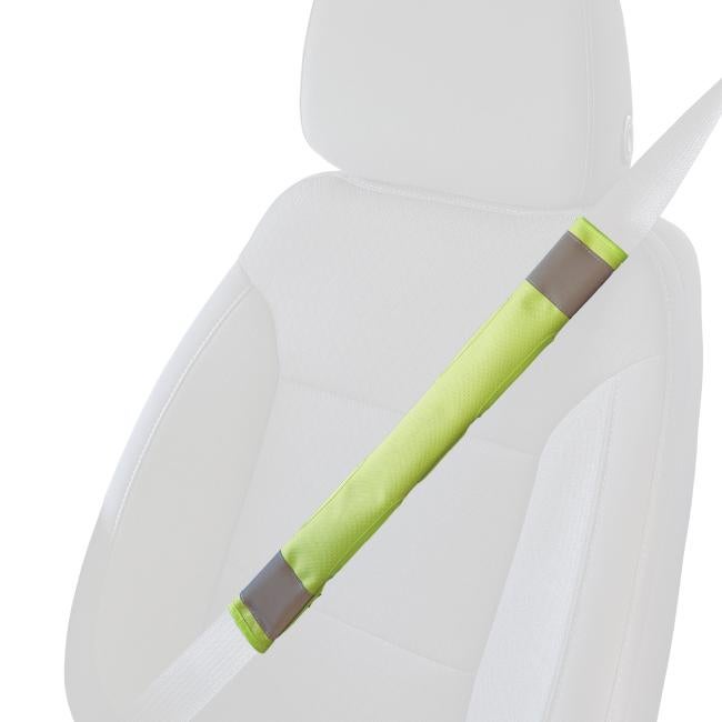 Lime hi vis seat belt cover on a faded seat belt over a faded car seat