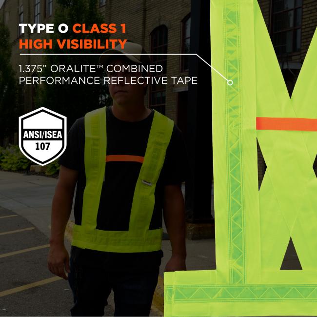 Person wearing neon yellow high-visibility vest with reflective tape; large close-up of neon vest panel and safety badge visible