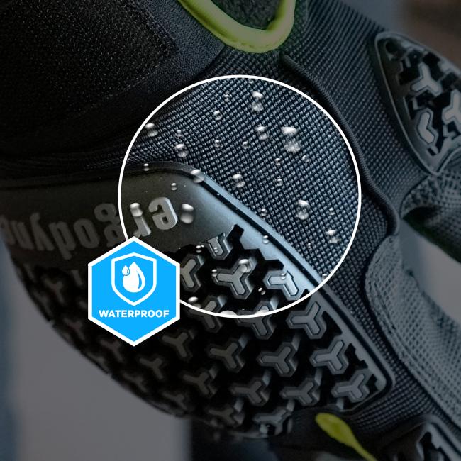 Close-up of shoe textured fabric and patterned rubber sole with water droplets, magnified circular inset, neon yellow accent and partial waterproof badge